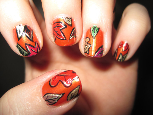 leaf motif is referenced in this nail design where part of the leaf 