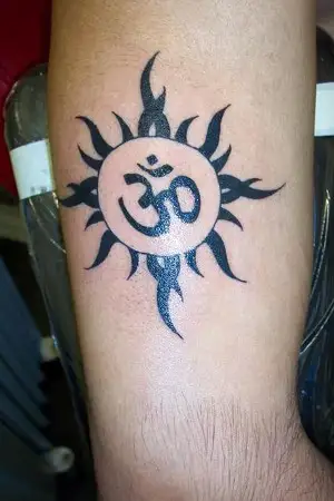 Om with sun tattoo done at xpose tattoos jaipur