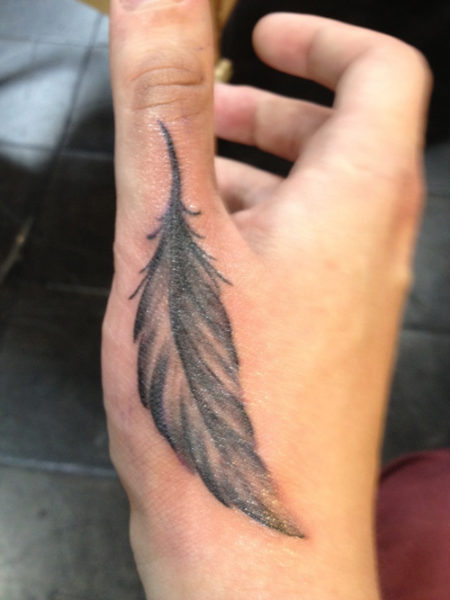 A Feather Tattoo Design On Hand