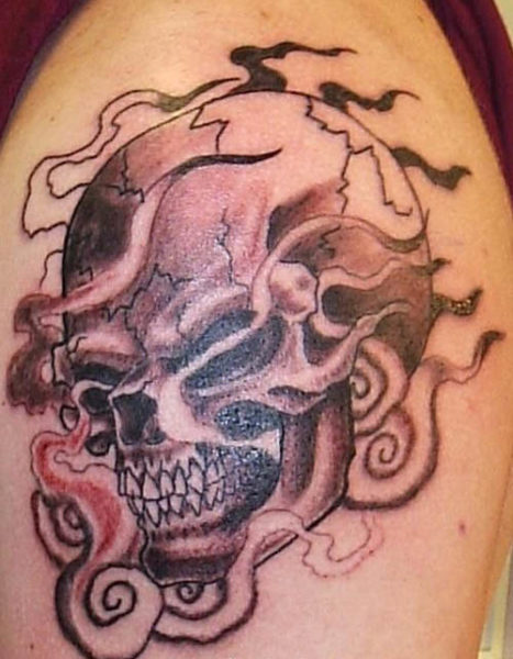A Flaming Skull Tattoos Design on Arm