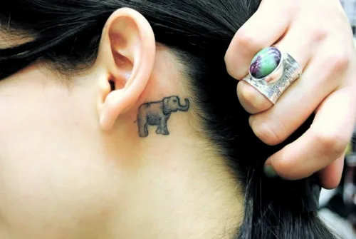 A Small Elephant Tattoo Behind The Ear