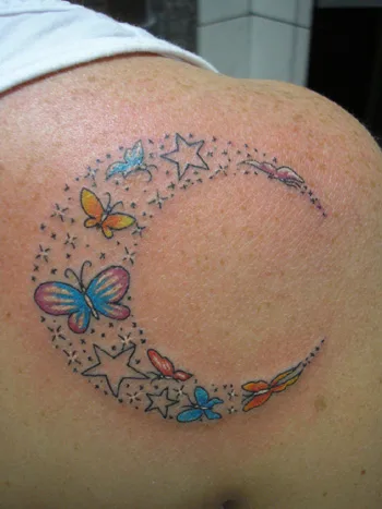 Fine line butterfly and sun and moon tattoo