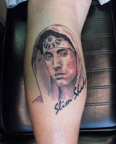 Wrist Tattoo with Eminem’s Slim Shady 3rd Album