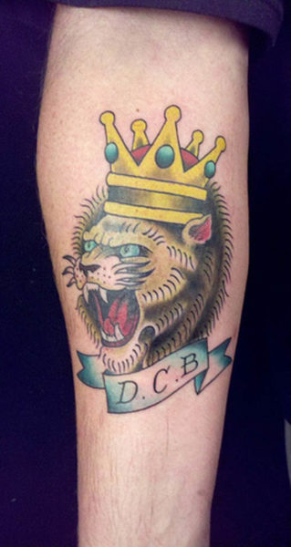 Roaring Lion Face Tattoo with Crown