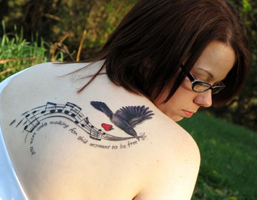 Bird Tattoo with Musical Symbols