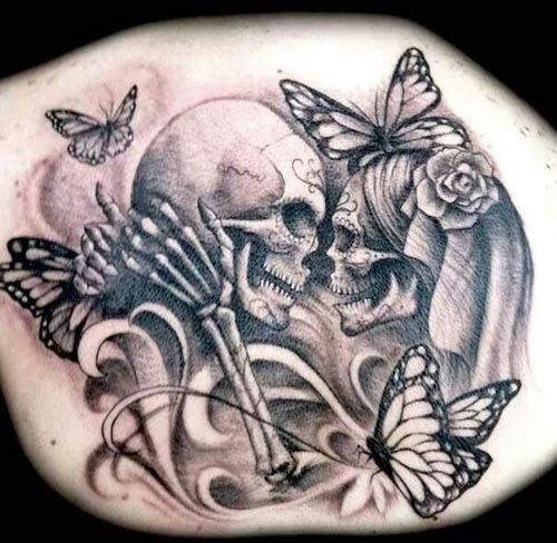 Skull Couple Tattoo with Butterflies on Back