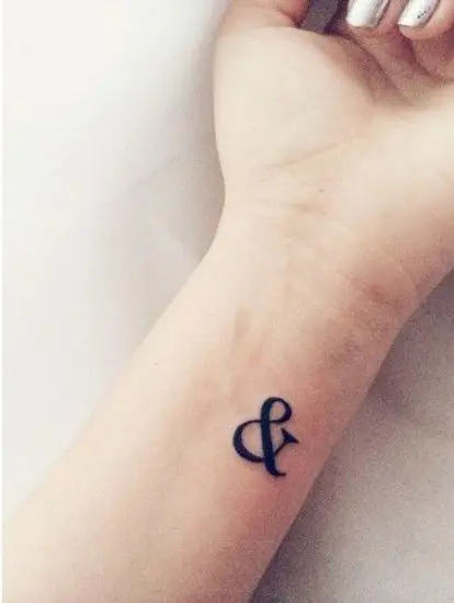 Small “&” Tattoo Symbol on the Wrist