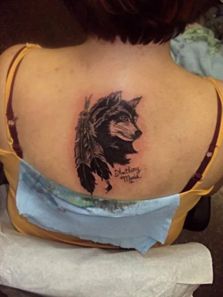 Realistic color watercolor wolf tattoo by Sorin Gabor TattooNOW