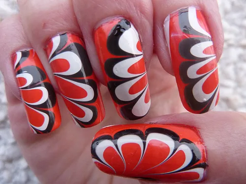 Red floral water marble nail design