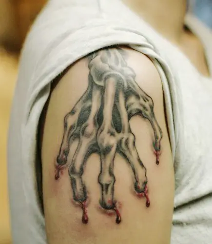 32 CreepyCool Skeleton Hand Tattoos