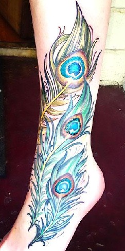 peacock feather tattoo on thigh