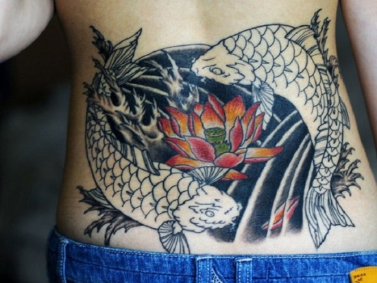 Lower Back Koi Fish Tattoo With Lotus