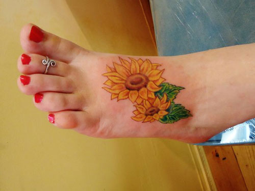 Foot tattoo on sunflower