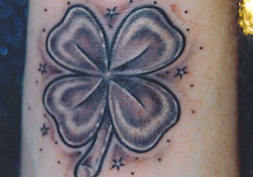 Shamrocks and stars tattoo