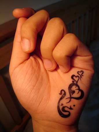 tribal style hand tattoo designs