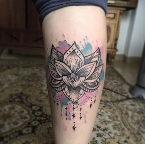 Tiny flower tattooed on the calf  Tattoogridnet