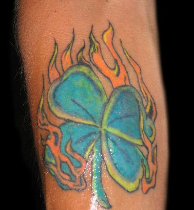 Colorful clover tattoo with flame design