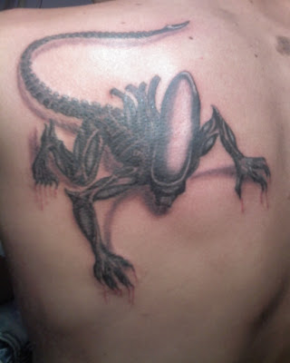 Dragging Alien Tattoo Design