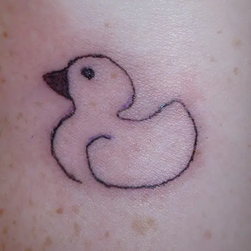 Minimalistic duck tattoo located on the forearm