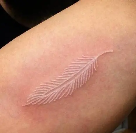 Simple White Ink Classy Feather Tattoo