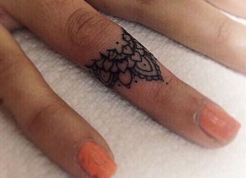mandala finger tattoo