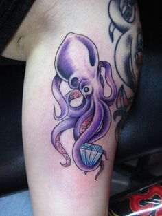 Purple octopus style tattoo