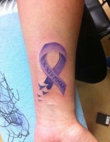 Purple ribbon in style tattoo