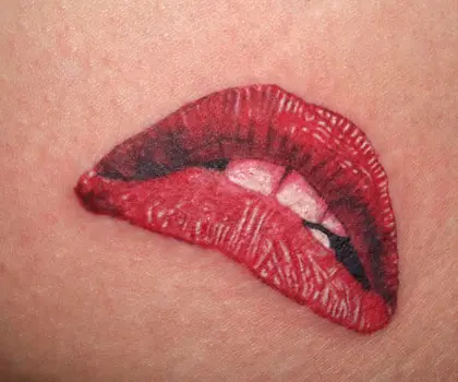 Red lips tattoo on neck