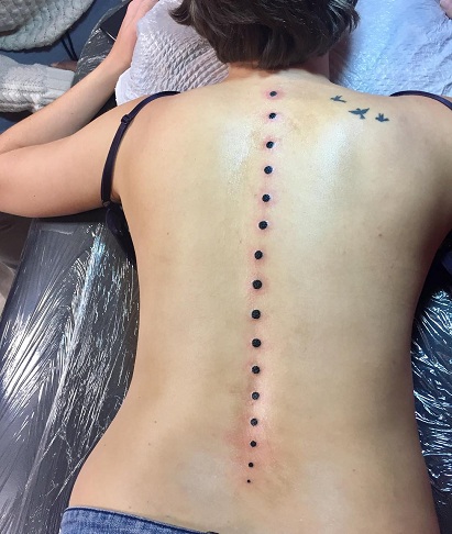 Black Dots Spinal Tattoo