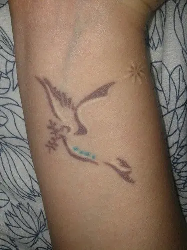 Dove tattoo signifies rebirth spiritual growth and peace  Hilltop Views