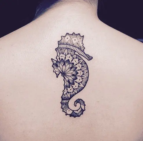 Minimalistic style seahorse tattoo located on the