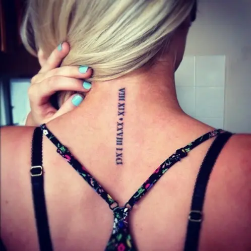 Roman numerals tattoo on the rib