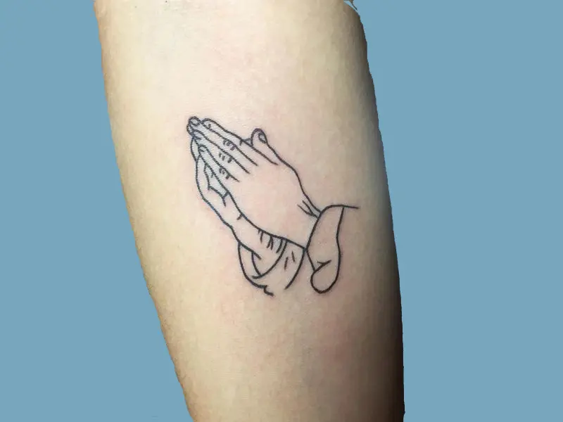 Praying hands with rosary and shining tattoo Vector Image