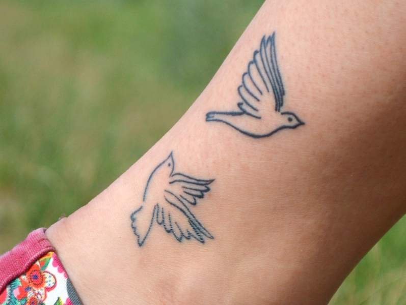 50 Adorable And Meaningful Dove Tattoo Designs You Will Definitely Love   Tats n Rings  Small dove tattoos Dove tattoos Wrist tattoos for women