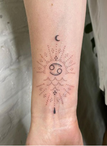 Intricate Cancer Tattoo On The Arm