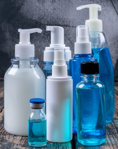 Liquid Soaps And Sprays Side View On A Dark Wooden Background