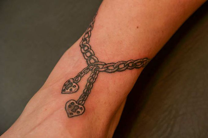 Chainlink bracelet tattoo by Tine DeFiore inked on the right wrist   Tattoos Tattoo bracelet Wrist tattoos