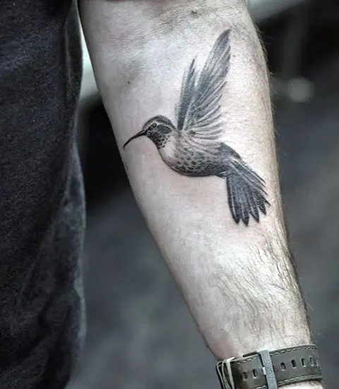 Hummingbirds tattooed on neck by Man