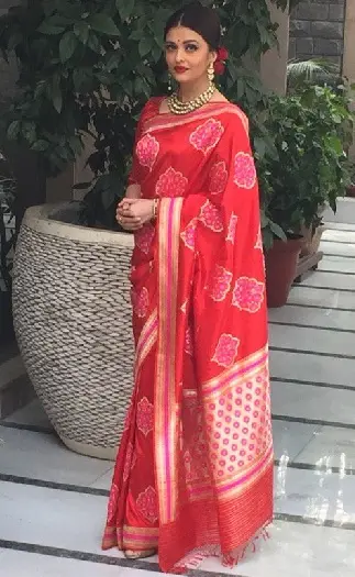 Aishwarya Rai in saree with classic bun hairstyle