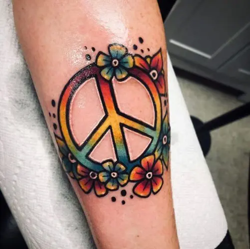 Watercolor style galactic peace symbol tattoo on the