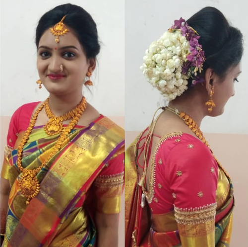 bun hairstyle for saree with flowers