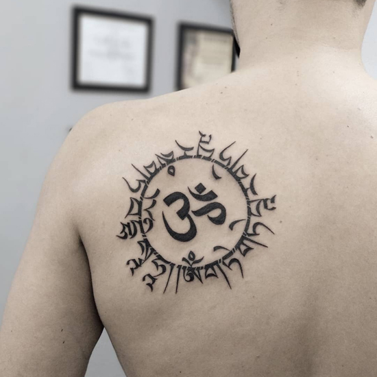 The Full Om Meaning + How To Wear, Tattoo, & Pronounce This Spiritual Symbol  | The Yogatique