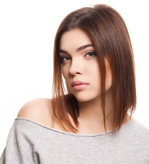 Image of A-line bob with blunt bangs for oval face Indian girl