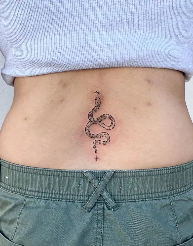 Realistic snake tattoo on the right shoulder