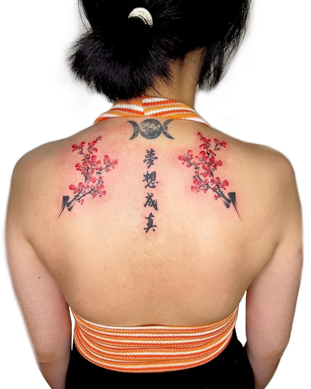 Asian Flower Tattoo On The Back