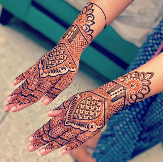 Beautiful Bridal Mehndi Design At The Back Of The Hand