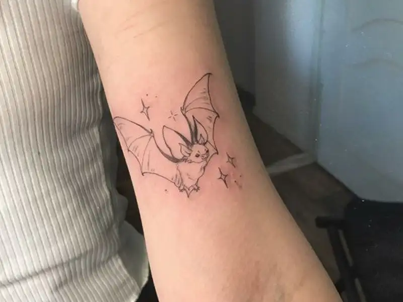 Bat tattoo on the neck