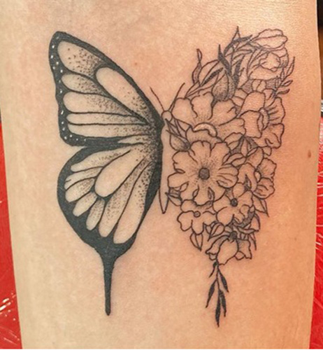 Impactful Butterfly Hand Tattoo