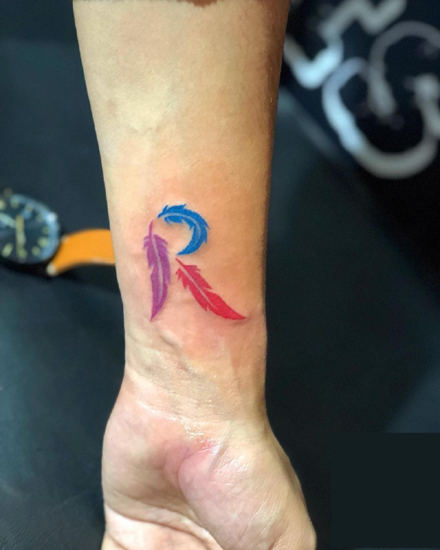 R Letter Tattoo With Feathers