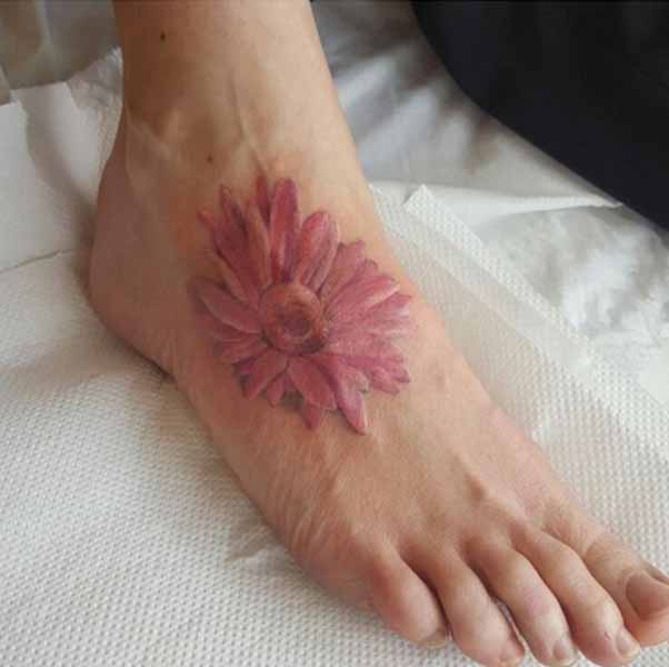 Brilliant Gerbera Tattoo On Feet